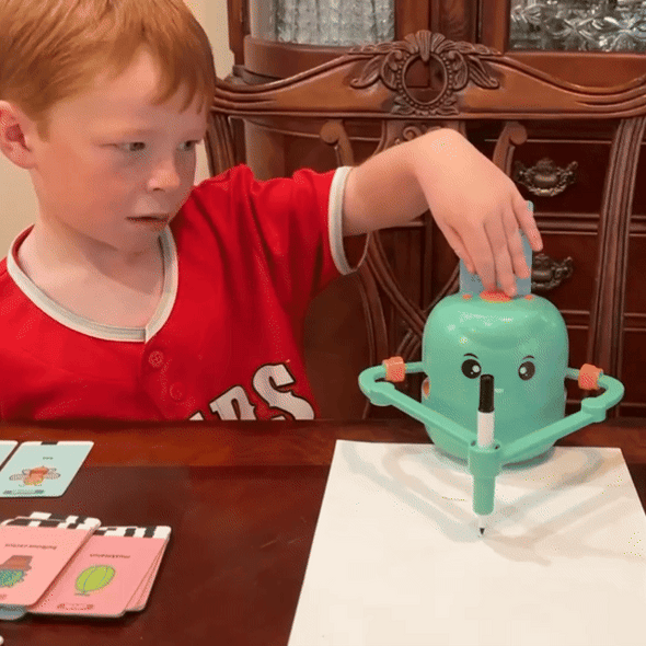 Load video: <p> <strong>Give your child the gift of imagination and early learning with the smart drawing robot that makes art simple, interactive, and magical. This educational drawing toy for children is more than just a fun gadget—it's a tool for cognitive growth, concentration, and creativity.</strong></p>